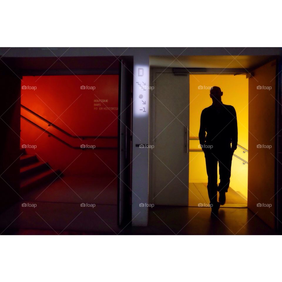 Red and yellow . Silhouette in the stairs with lights red and yellow 
