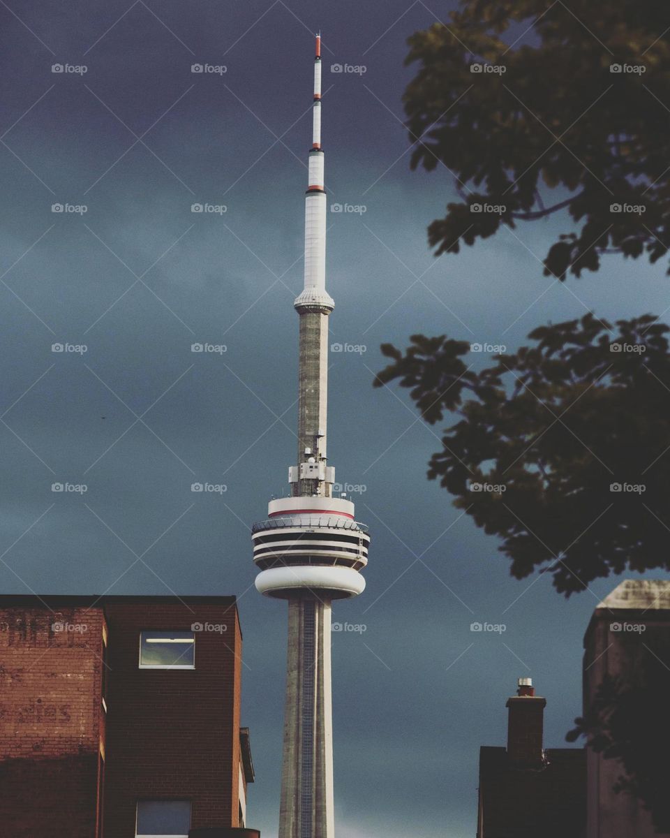 CN tower in Toronto Canada against moody gloomy summer sky before a storm