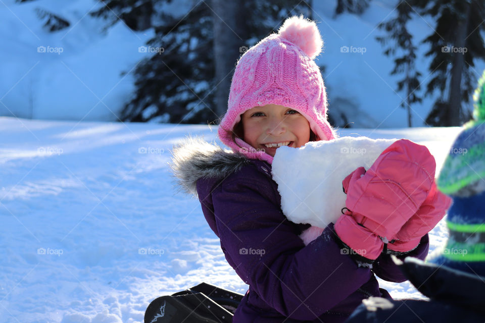 Child playing in the snow