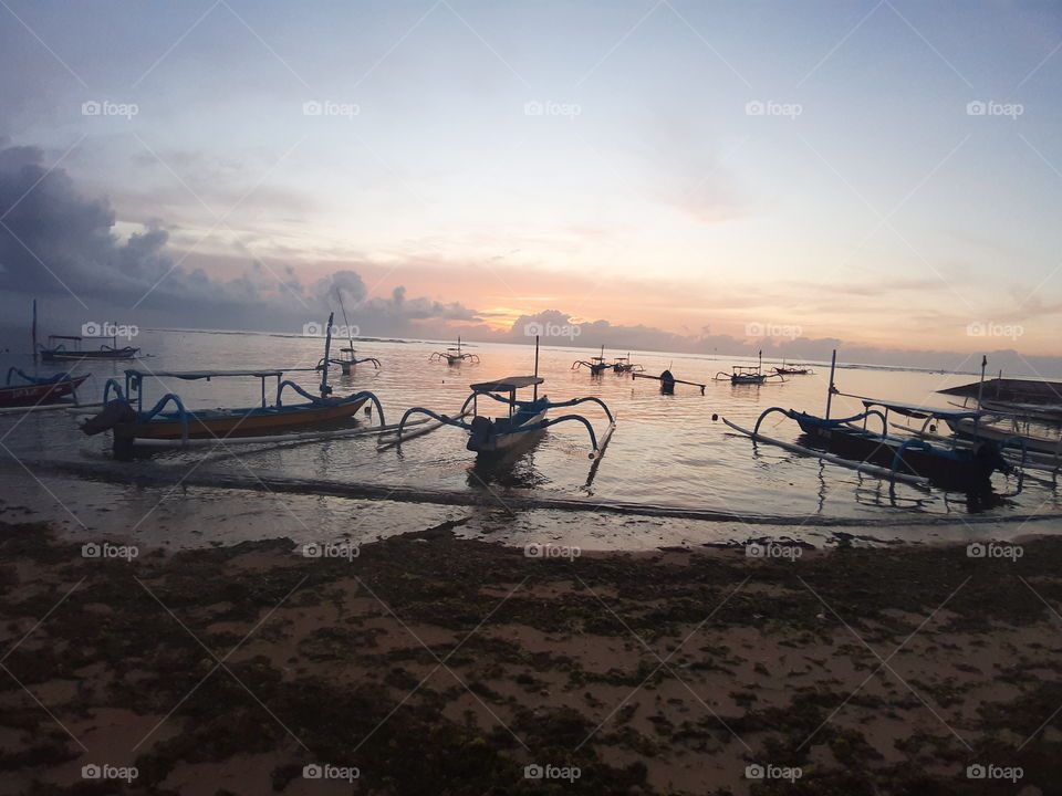 The fishing boats on the beach with beautiful view