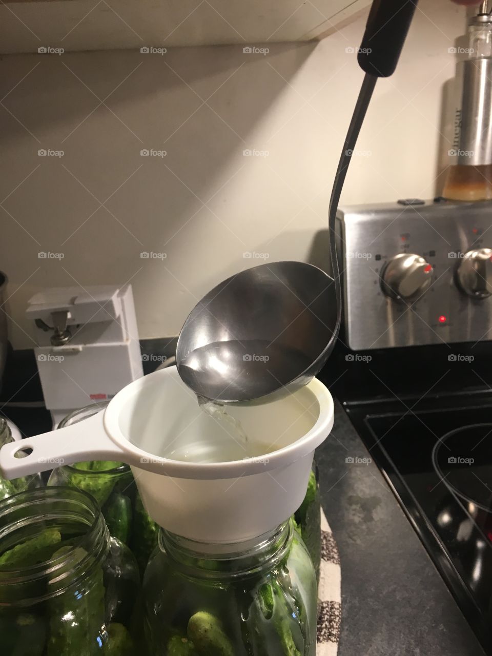 Adding brine to dill pickles