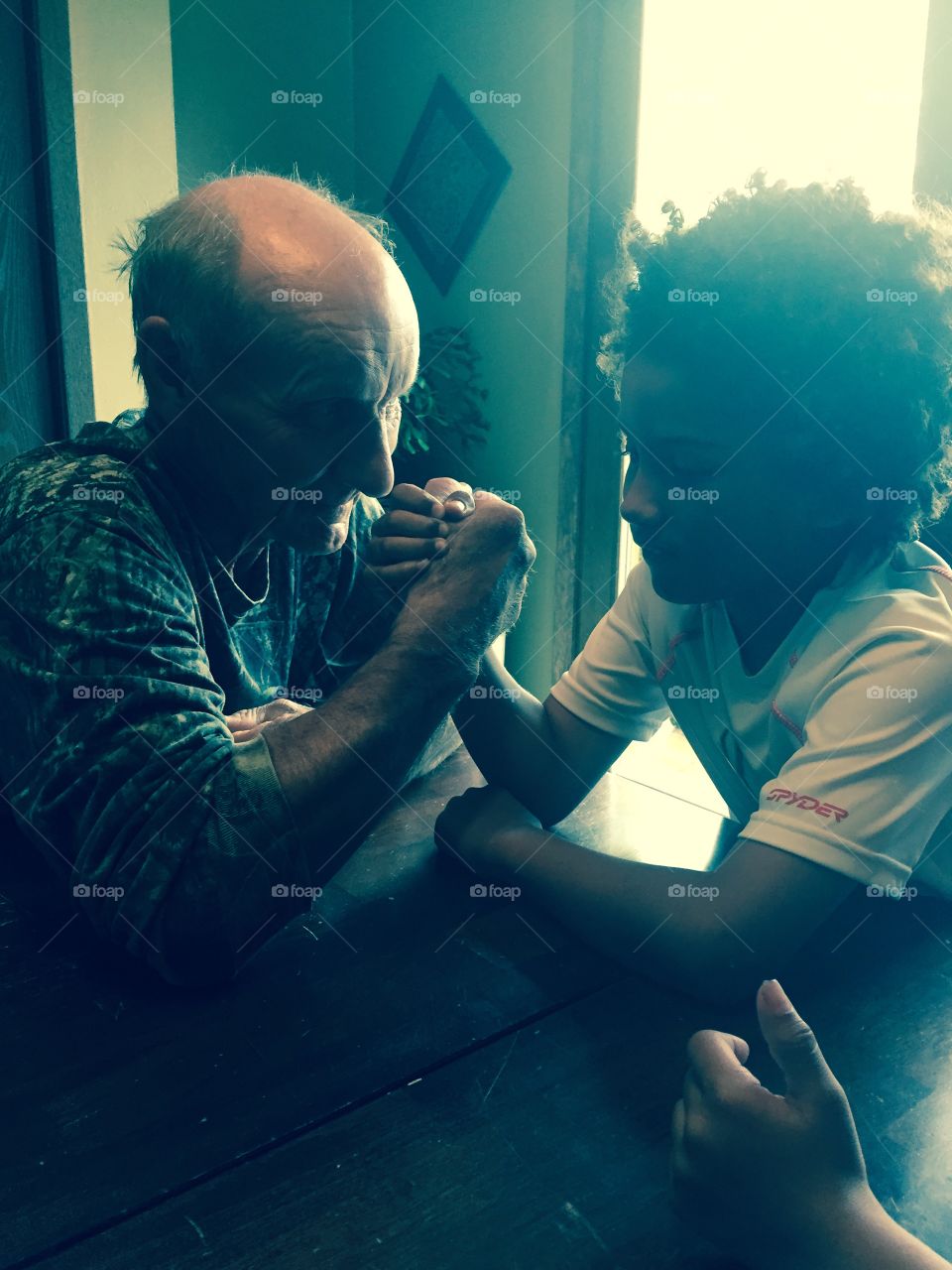 Grandpa and Me. Grandfather and grandson arm wrestling 