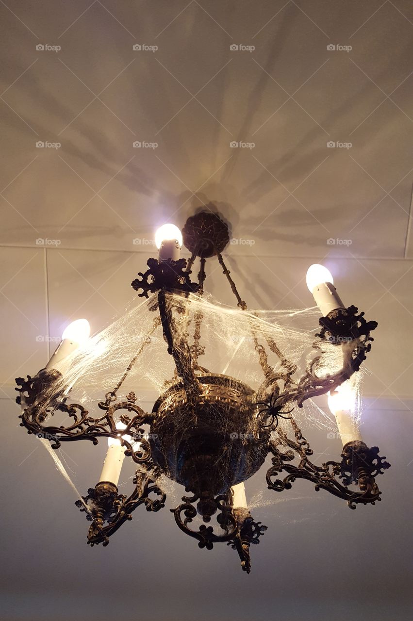 chandelier with spider web