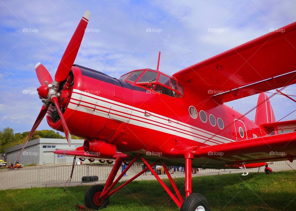 Red airplane AN-2, made in Ukraine.