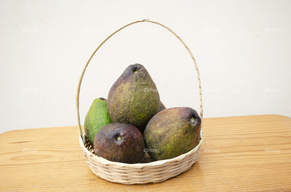 A Basket Of Avocados