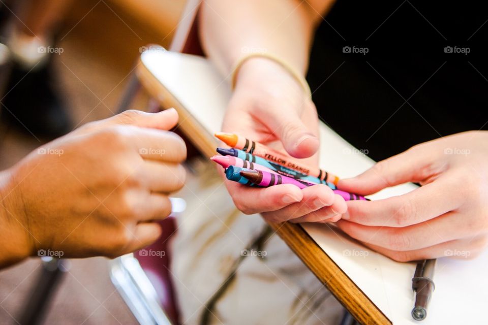 Students sharing crayons during class