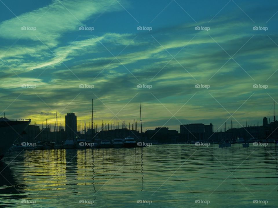 Boats moored at harbor