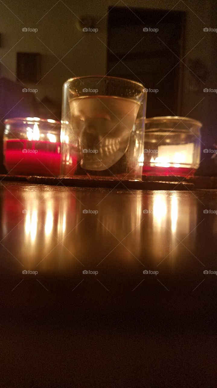 skull shot glass through the candlelight