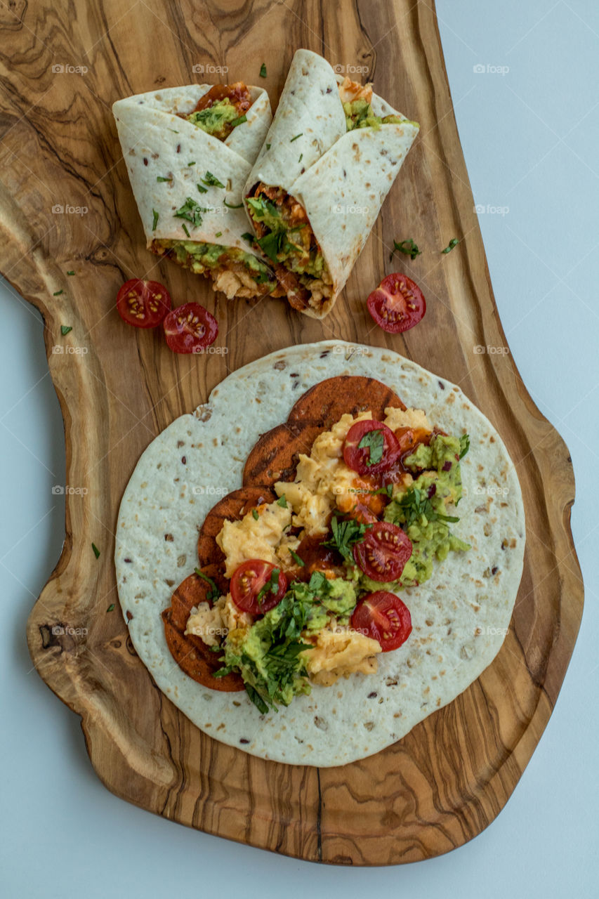 Burritos with scrambled eggs and pepperoni