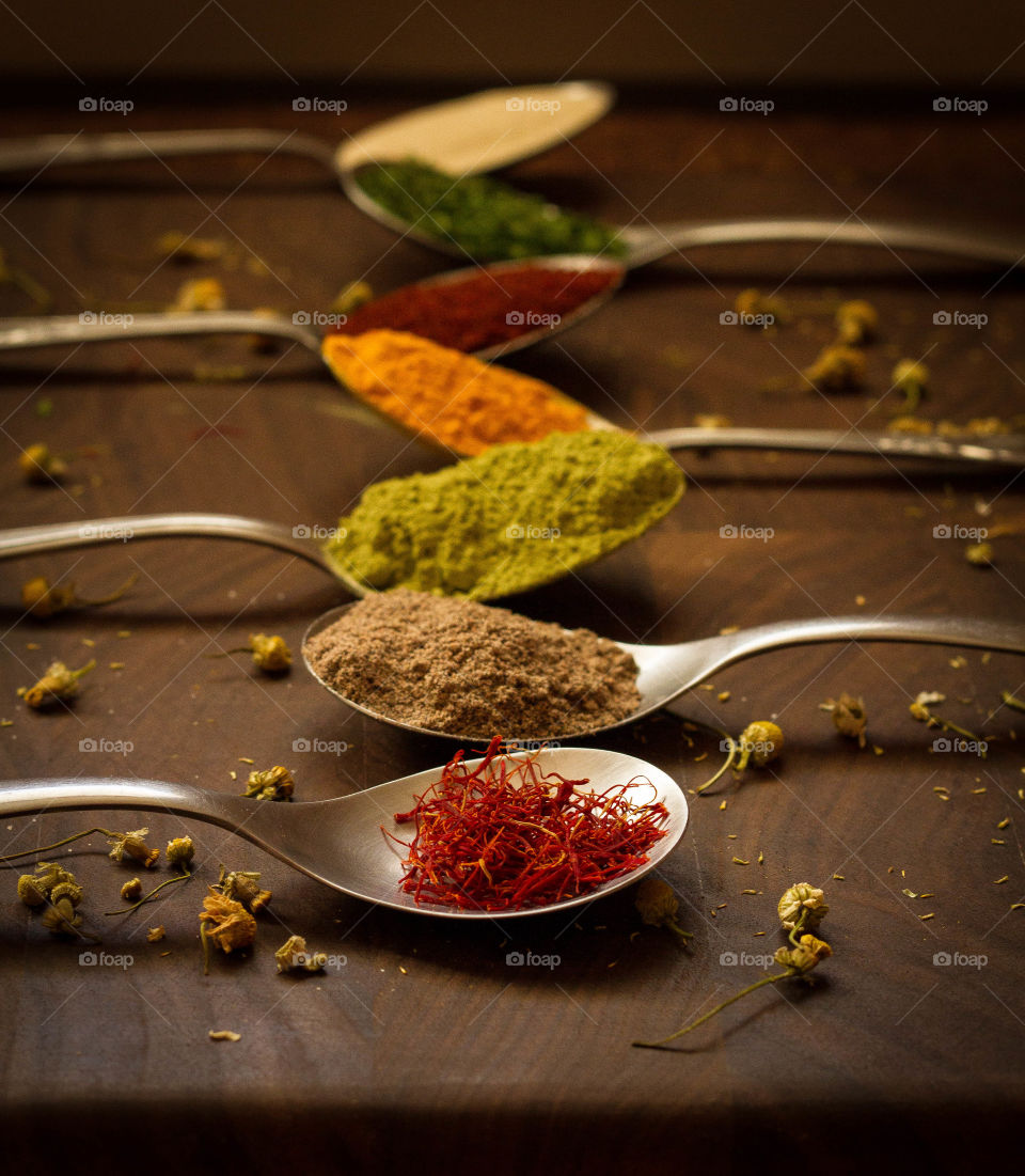 Spices on spoons in the kitchen 