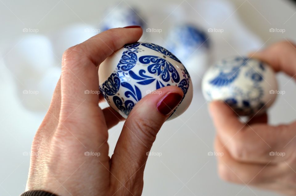 Easter eggs clinking in hands tradition