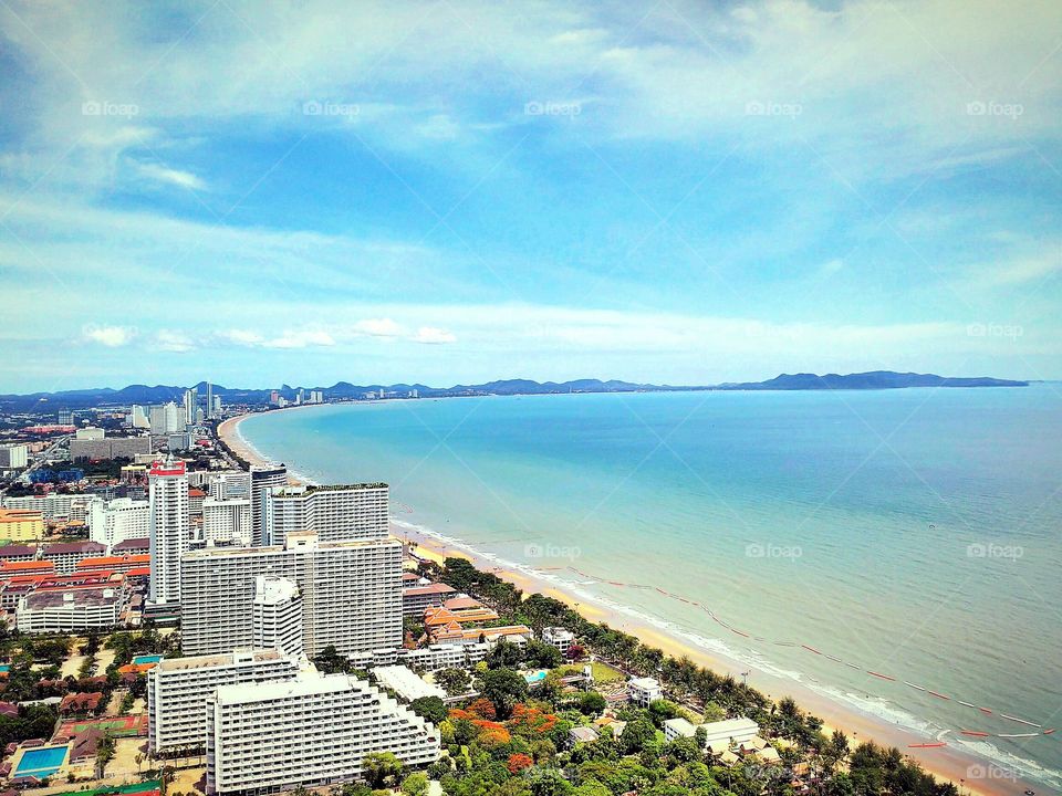 Scenic view of city near sea