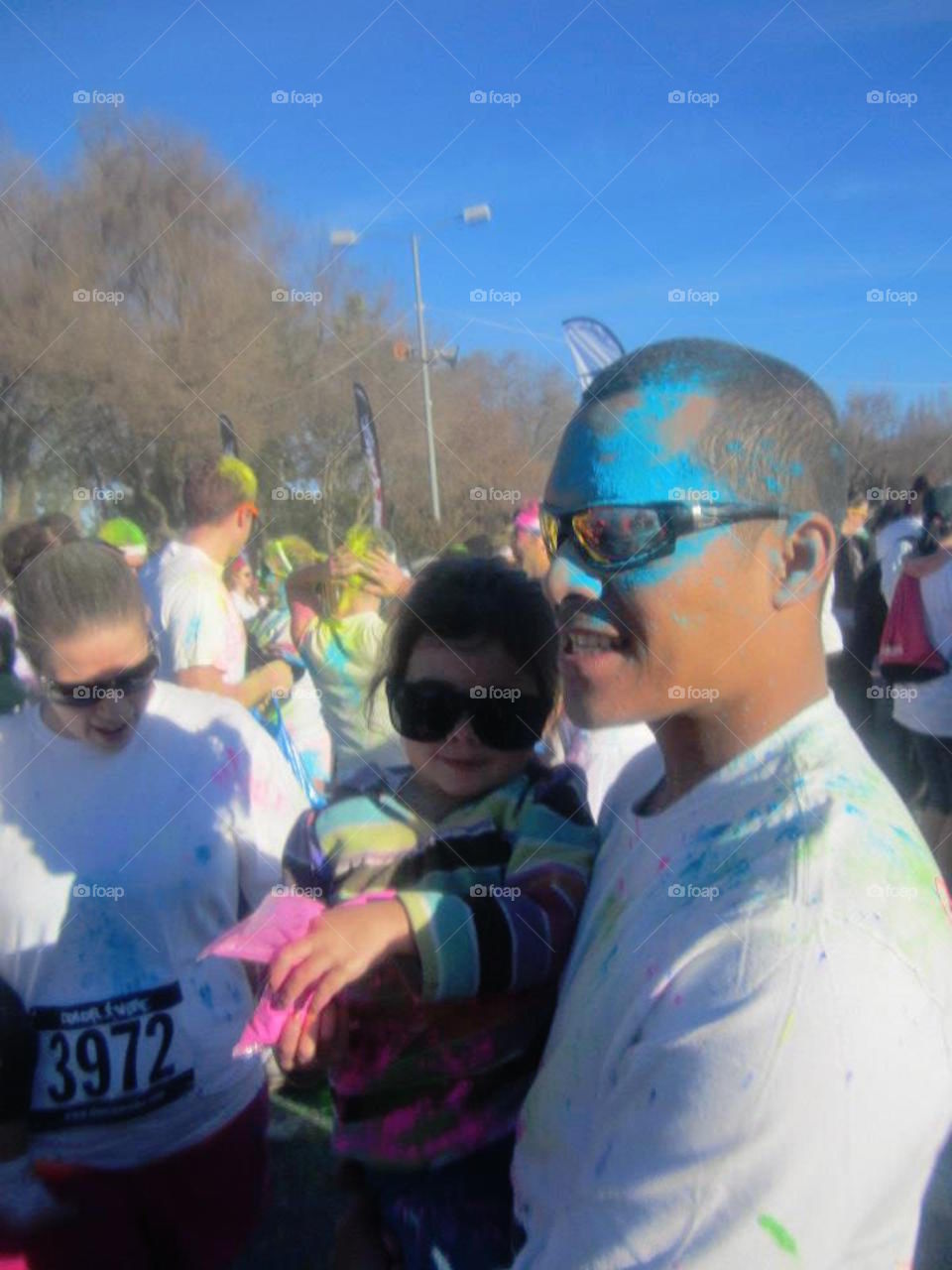 Dad and daughter after participating in a color run