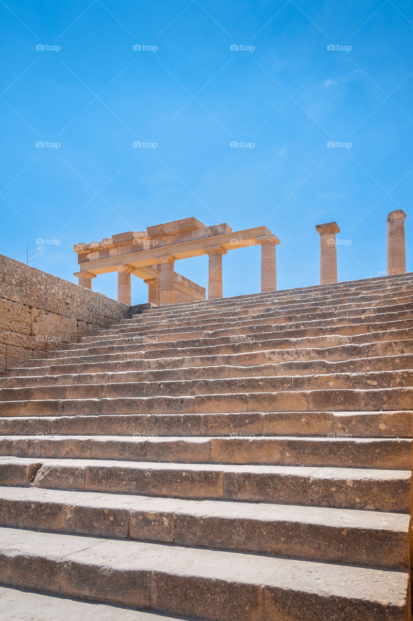Stairs leading up to ancient Athena Lindia Temple in Lindos Acropolis. Lindos. Island of Rhodes. Greece. Europe.