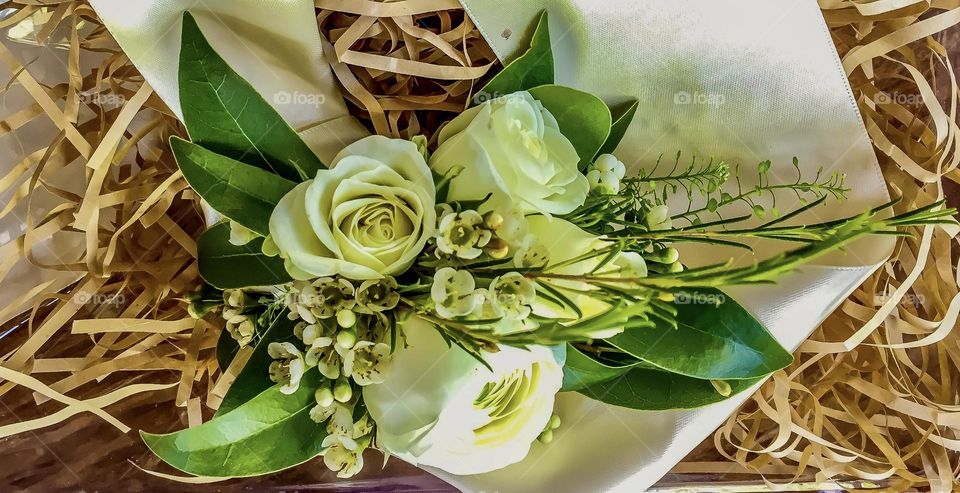 A white rose corsage.