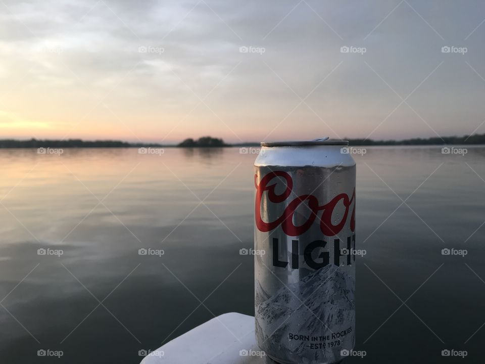 As the sun sets on the famous gun light Coors light blue Mountains will shine the color around setting at the famous docks at the Baypoint in restaurant and hotel