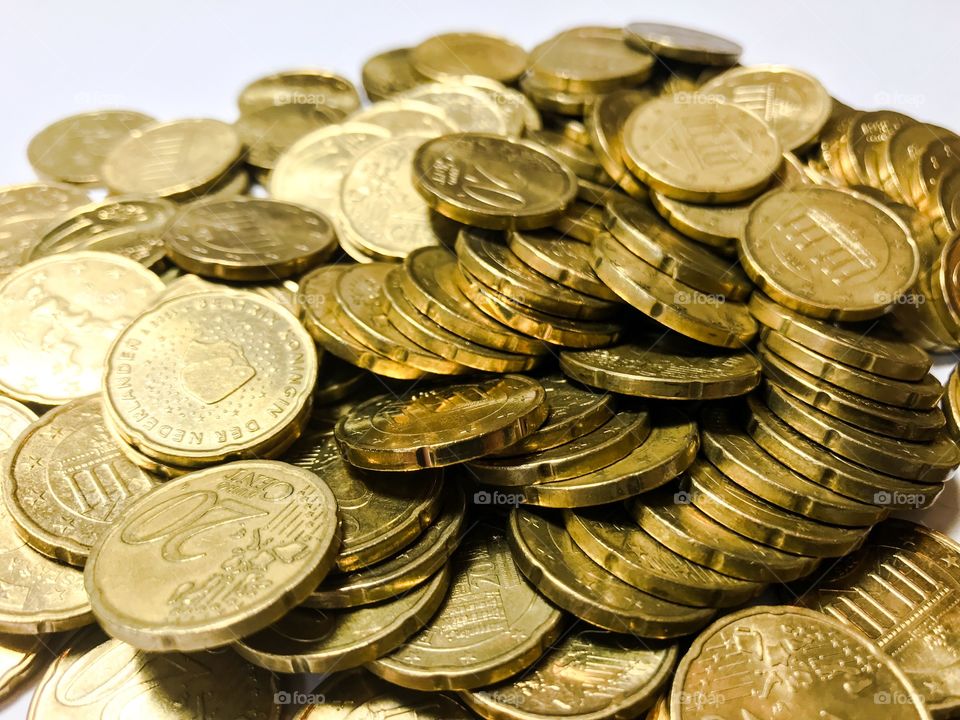 Pile of twenty euro cent coins 