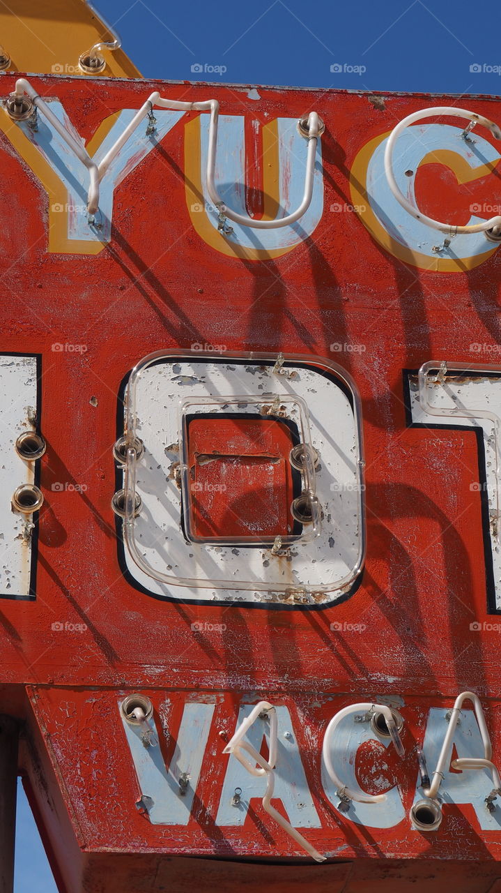 Faded neon sign. Vintage rusty neon sign