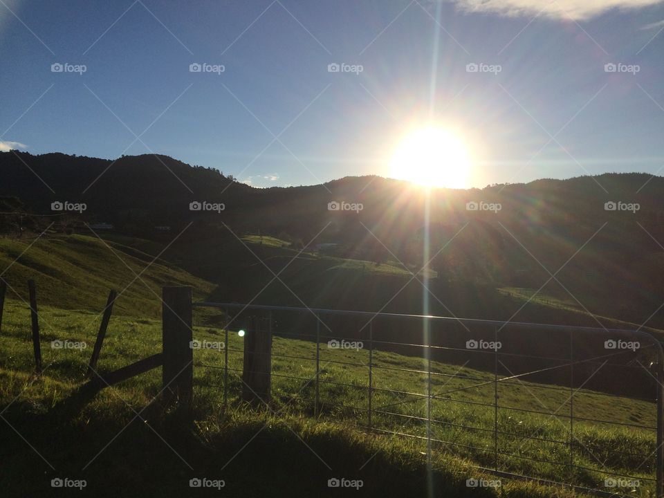 Sunset over hills in Tauranga, New Zealand 