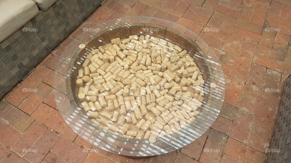corcks in an oak barrel covered with a glass table top at a winery Stellenbosch South Africa