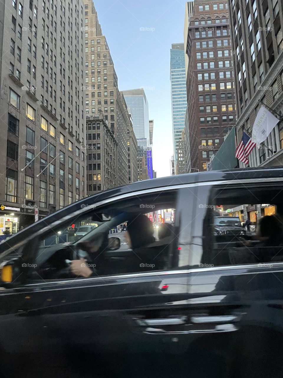 Early evening … taken through a window of a taxi, a window of a car overtaking … lights just appearing in homes in New York 