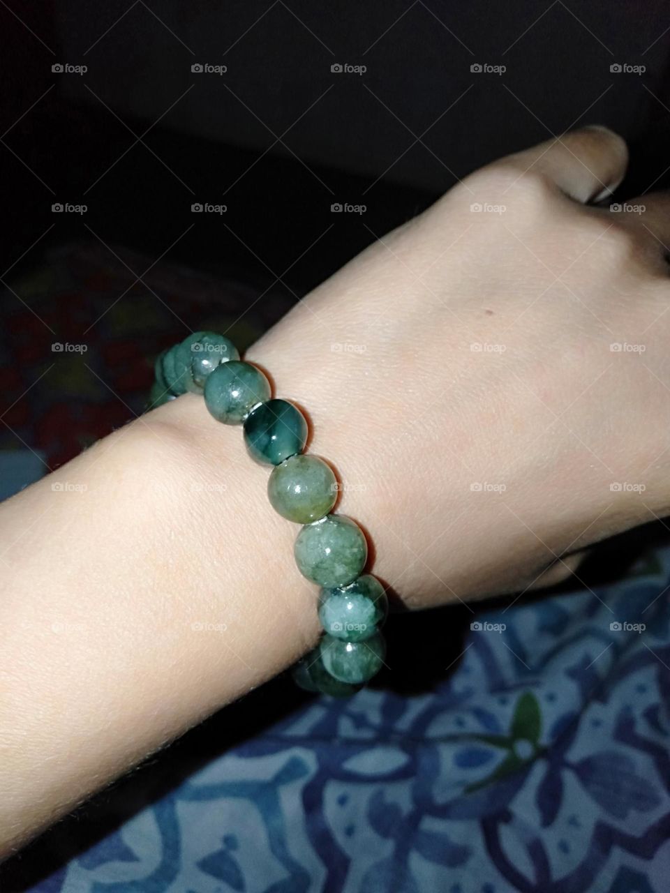 Wearing Authentic Jade stone bracelet made in Myanmar.