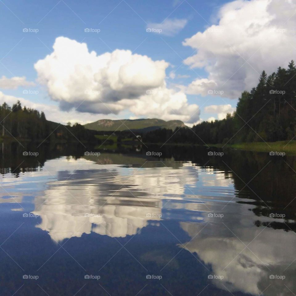 image of a water where the sky is reflected in the water
