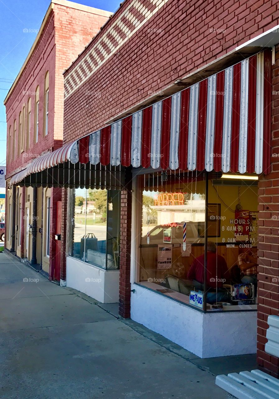 Red Color Story, red, reflecting, reflection, window, neon, neon sign, door, awning, barber, red and white stripes, brick, building, small town, early, morning, bench, sky, sidewalk, windows