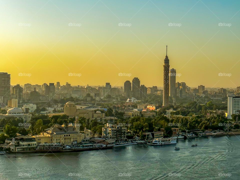 Cairo’s skyline and the river Nile at sunset, with the Cairo tower showing in the background  