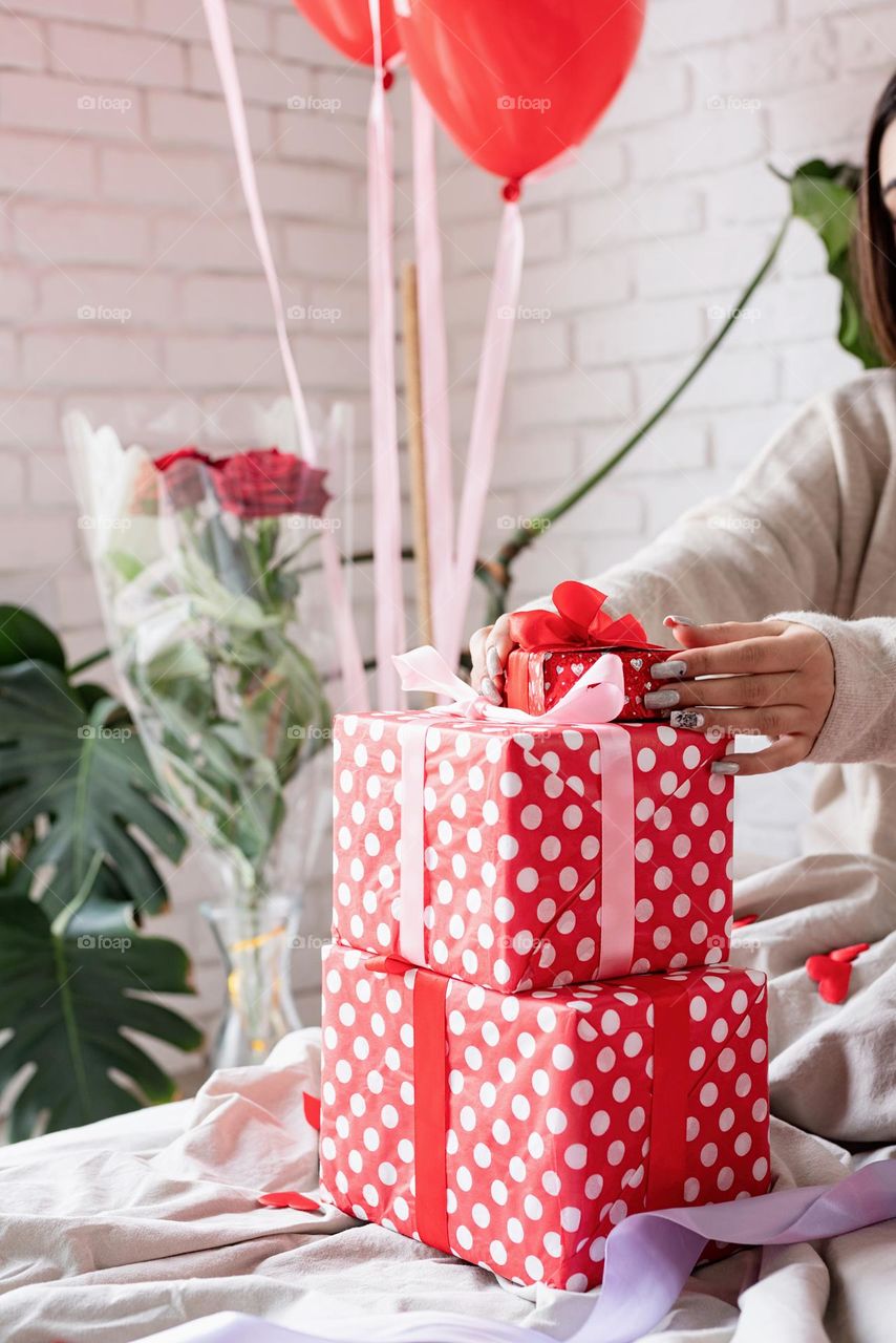 woman holding christmas gifts