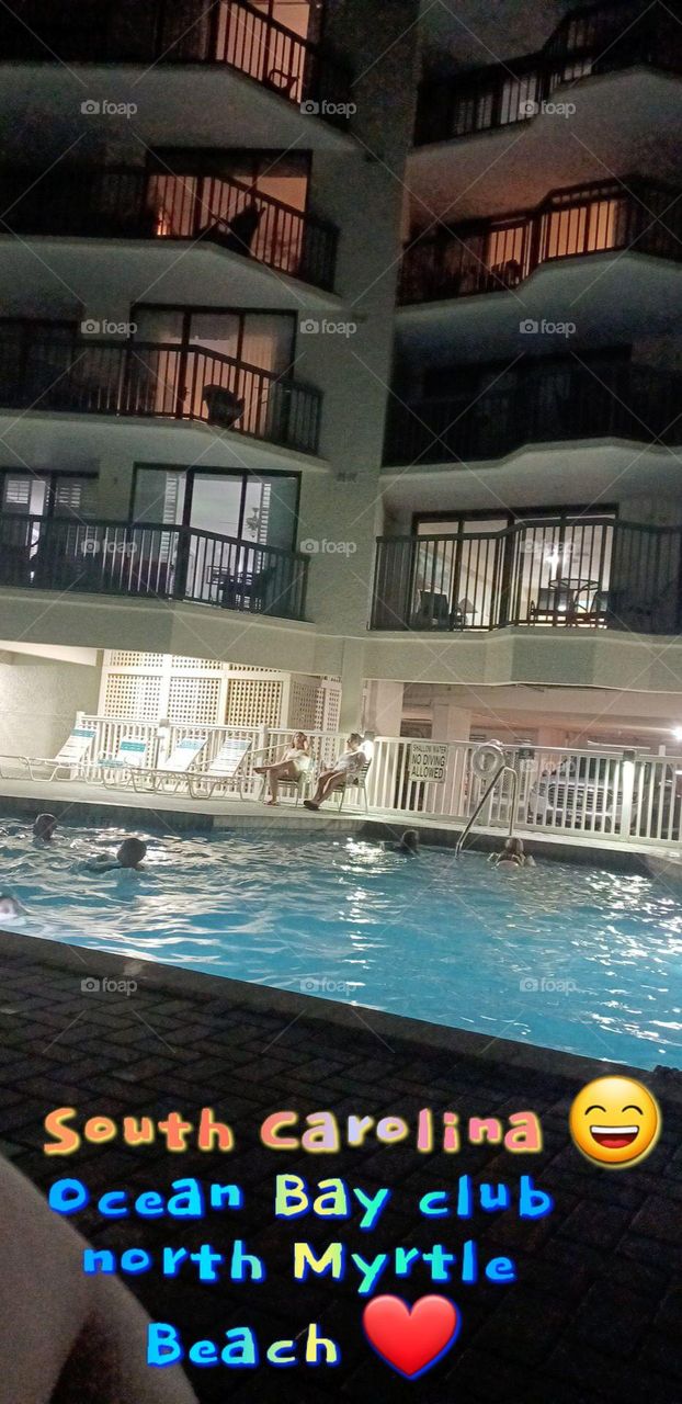 Night view of a lit up Outdoor pool at a hotel in North Carolina 