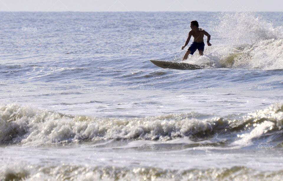 A man surfing in the ocean