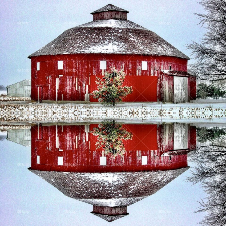 Beautiful winter at old red round barn
