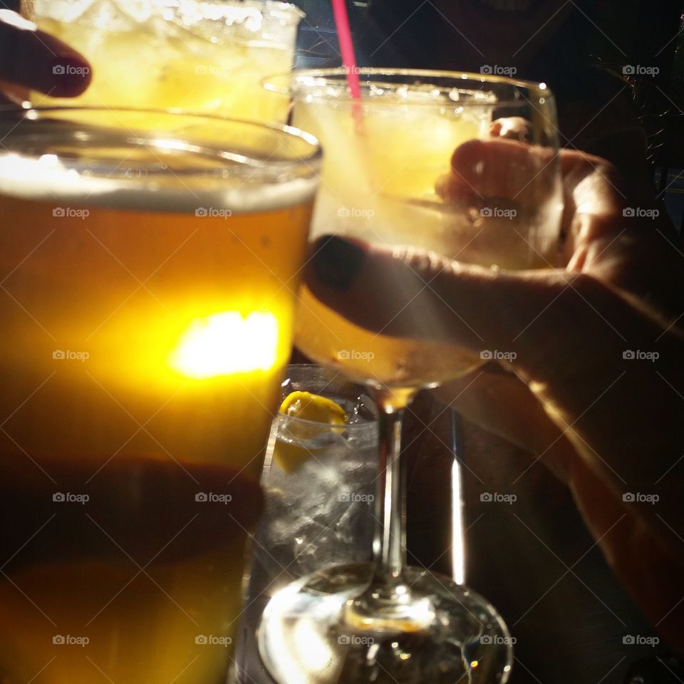 Golden Salute!. Raising our glasses while celebrating with friends, both familiar and new.