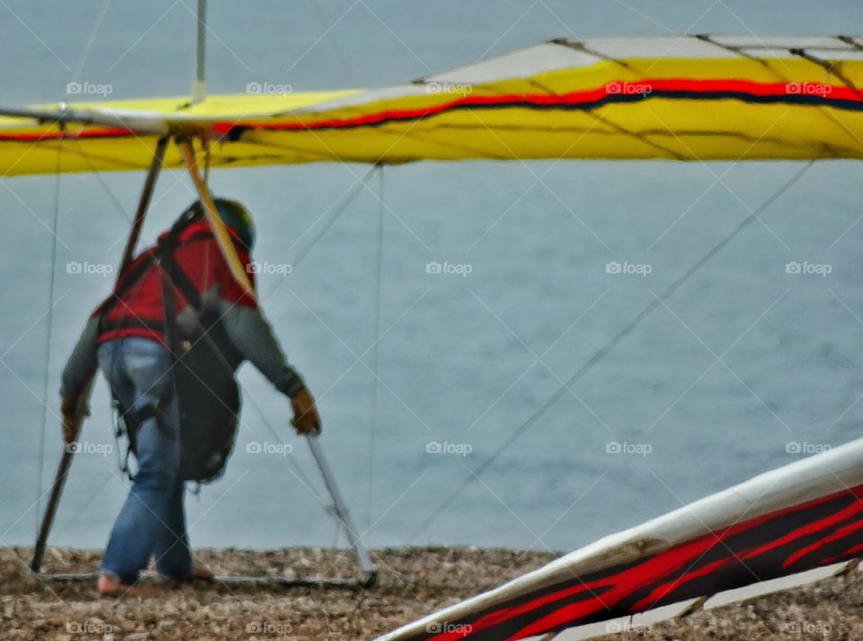 Preparing For Takeoff. Hang Glider Preparing To Launch Off A Cliff
