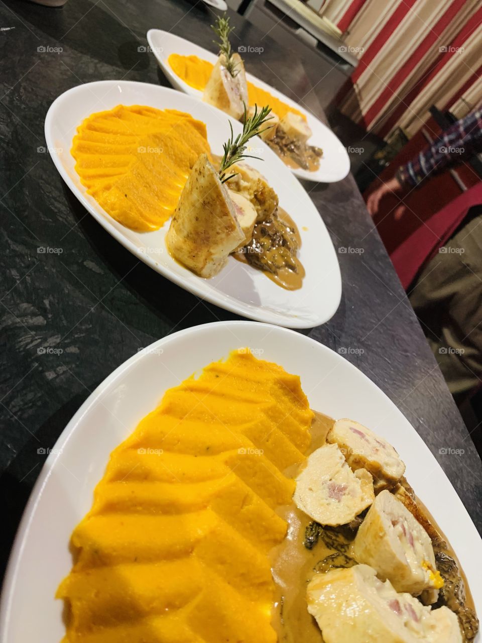 On the plate: delicious pumpkin puree and stuffed chiken sausage 