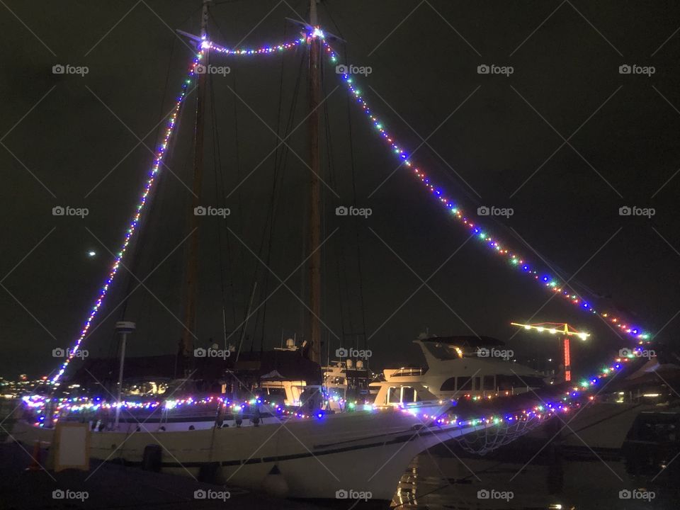 People have decorated their boats with lights for winter festivities and celebrations for Christmas and New Year at the South Lake Union in Seattle, WA