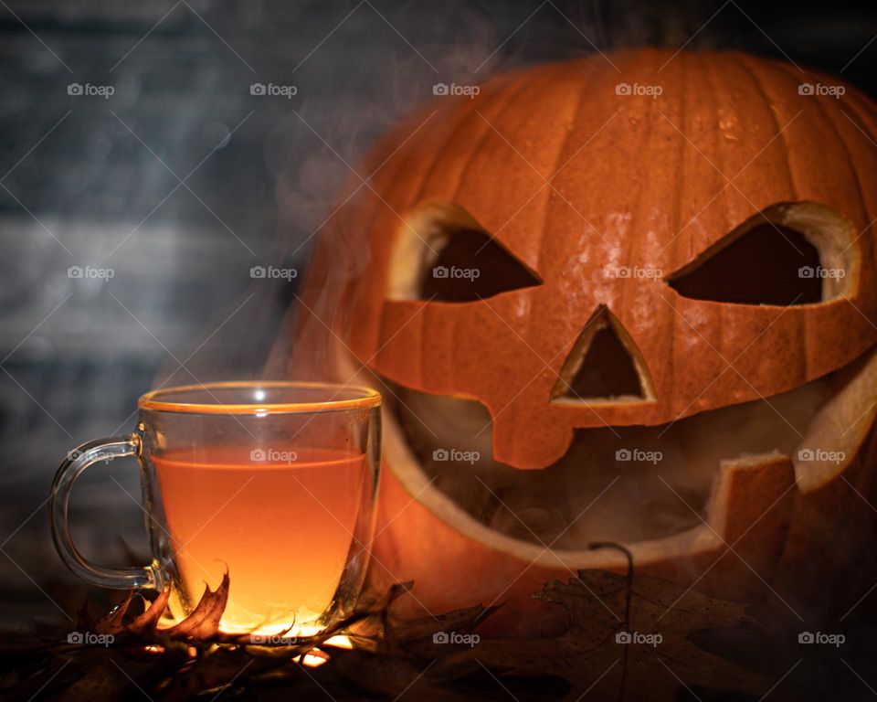 Hot cider and a happy jack o lantern