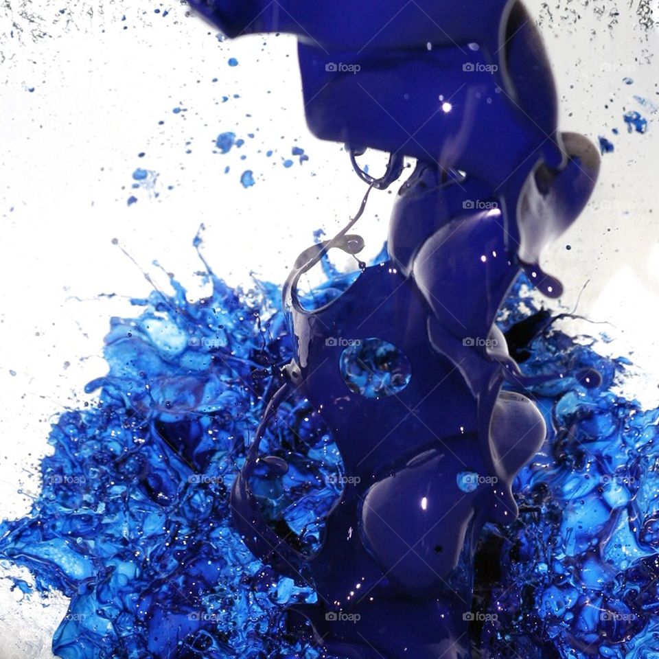 Blue paint trickle in a barrel