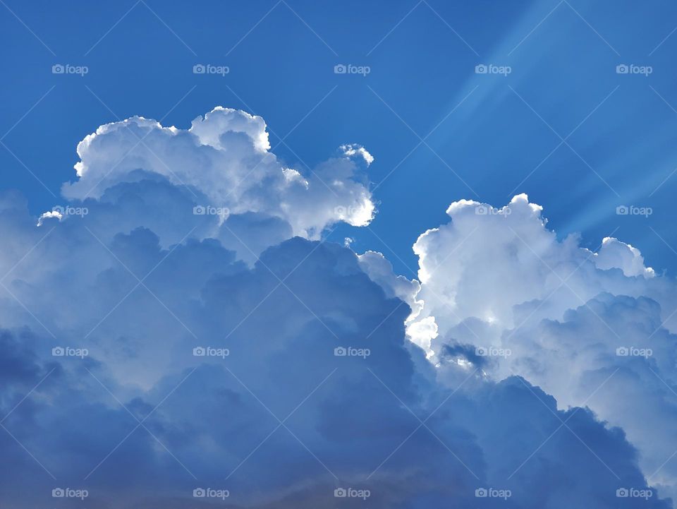 Sunlight Streaming From Behind Clouds