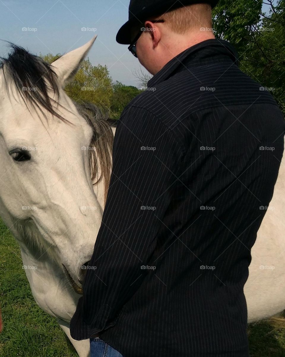 Glimmer of a Man Having a Special Moment with a Horse