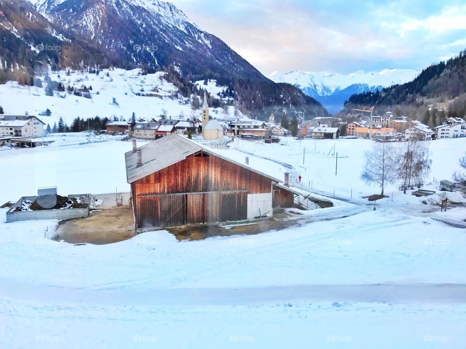 Wooden cabin in snow 