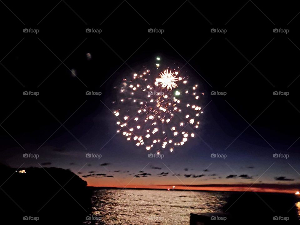 fireworks show over lake