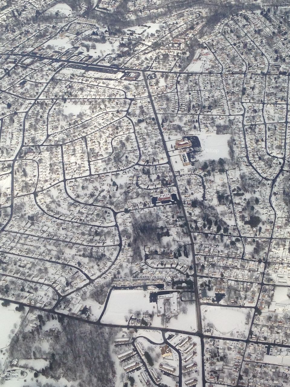 Frozen Pennsylvania . Flying over Pennsylvania, I noticed the frozen landscape with the streets freshly plowed. 