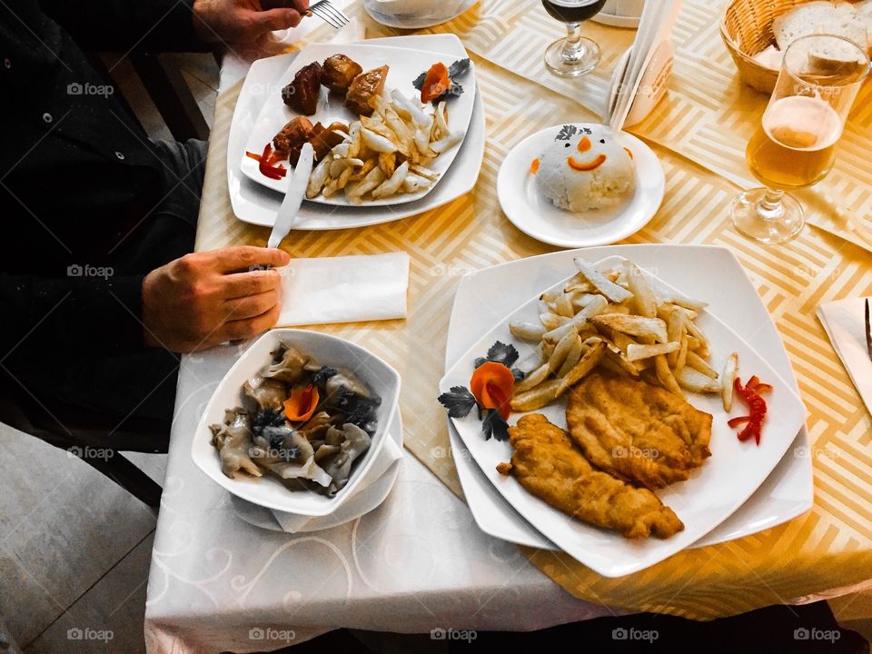 Man at restaurant eating food