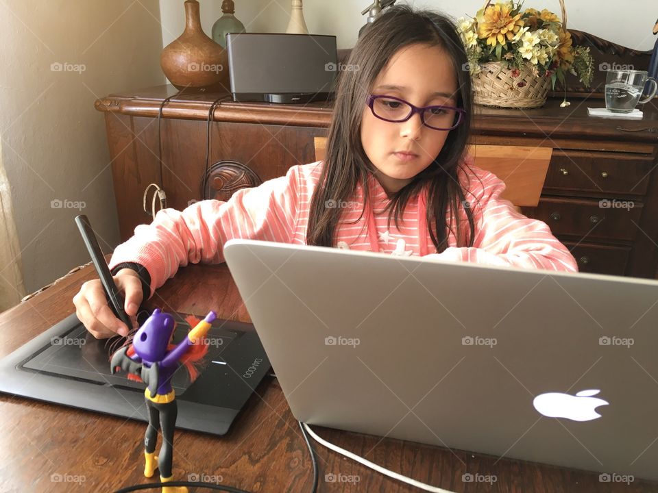 little girl using the computer