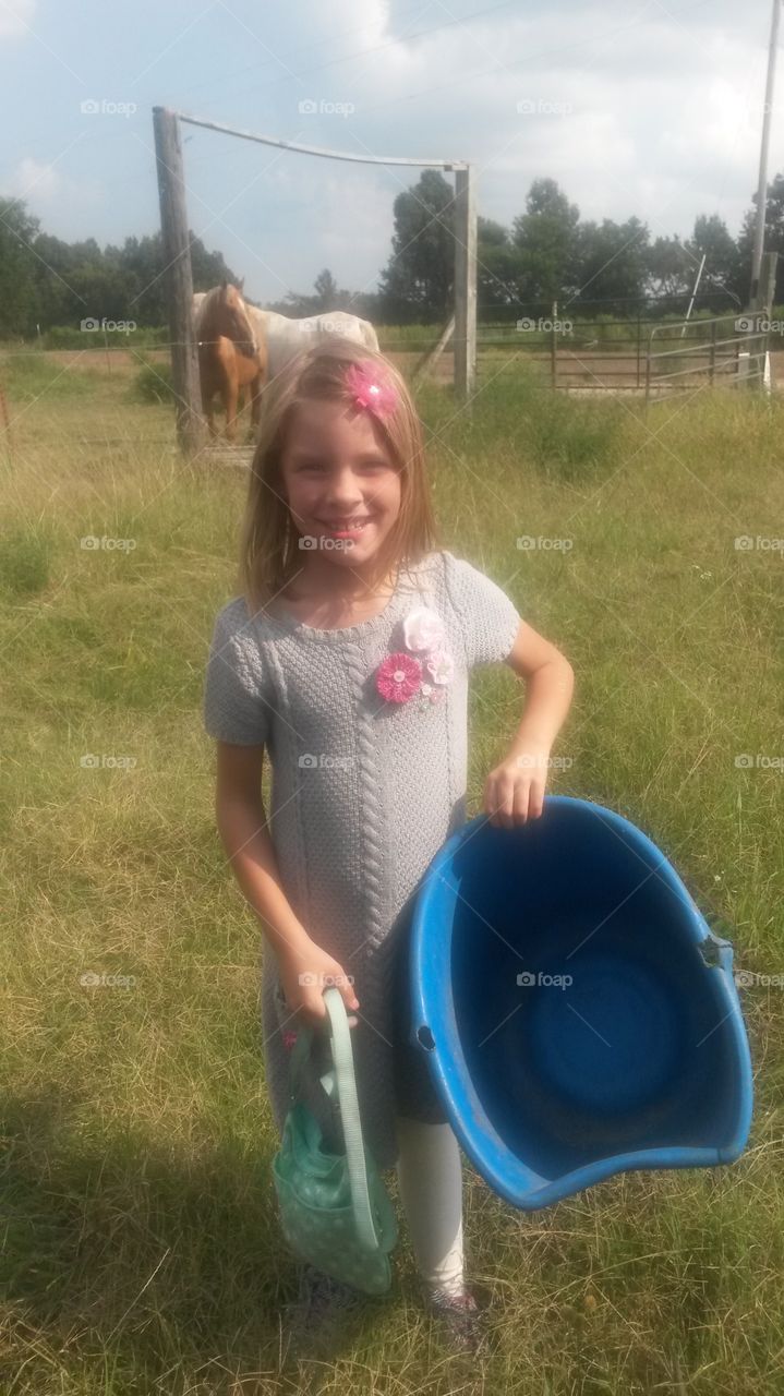 on the farm. She is going to feed her animals