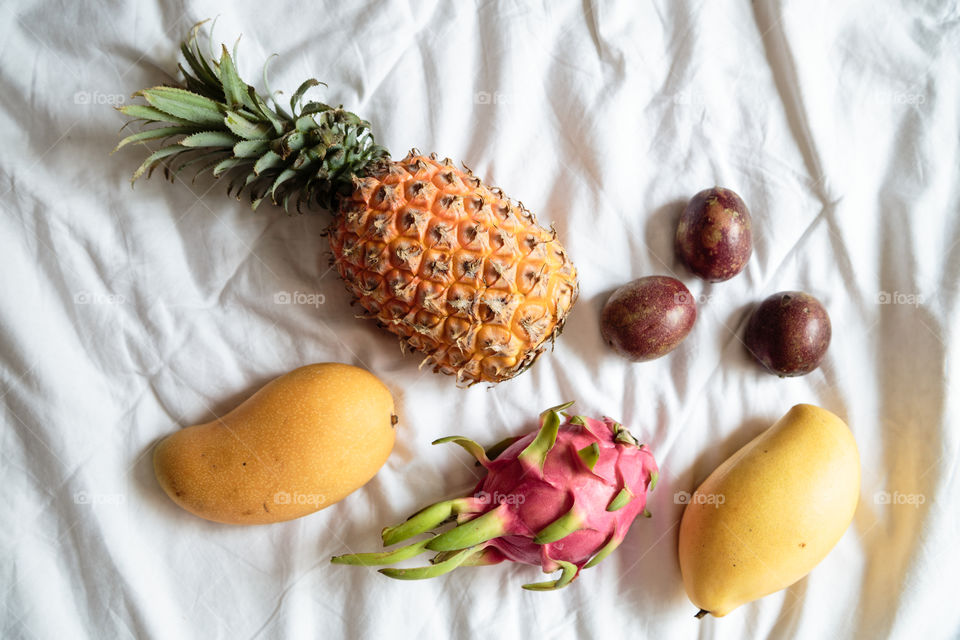 Fresh exotic fruits on the bed