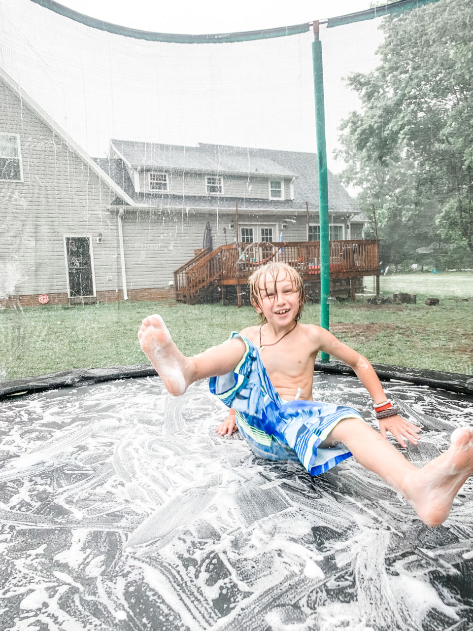 Sweet boy playing in the rain 