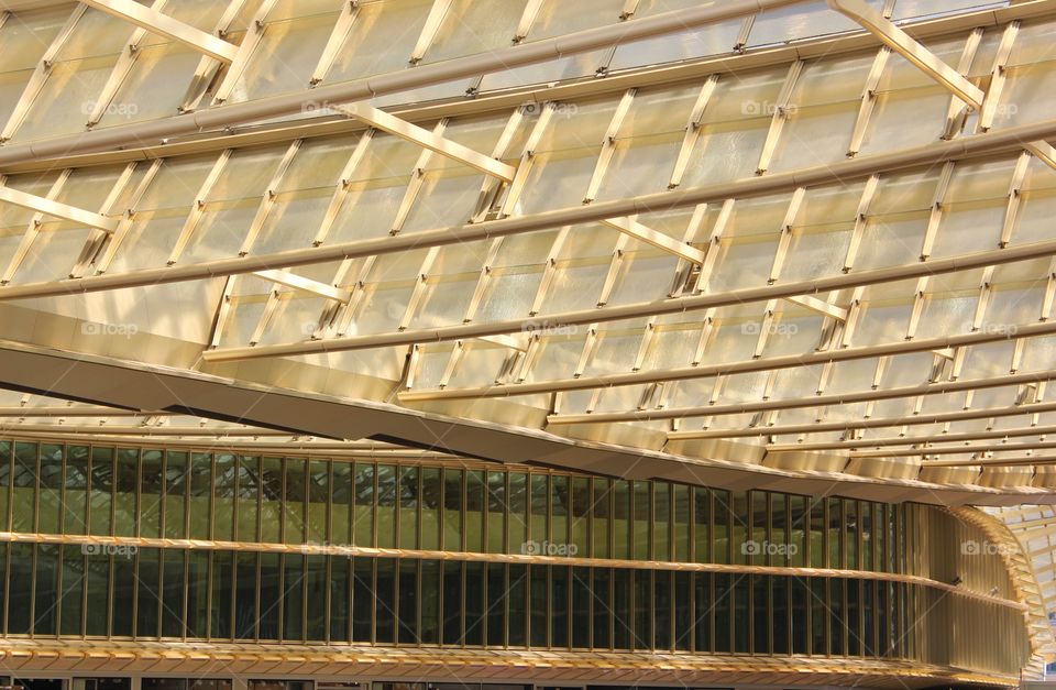 Structural design of the yellow roof of a open air shopping center in Paris.